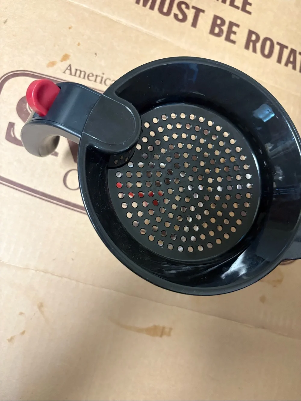 Black Plastic Strainer with Red Snap Lock Handle